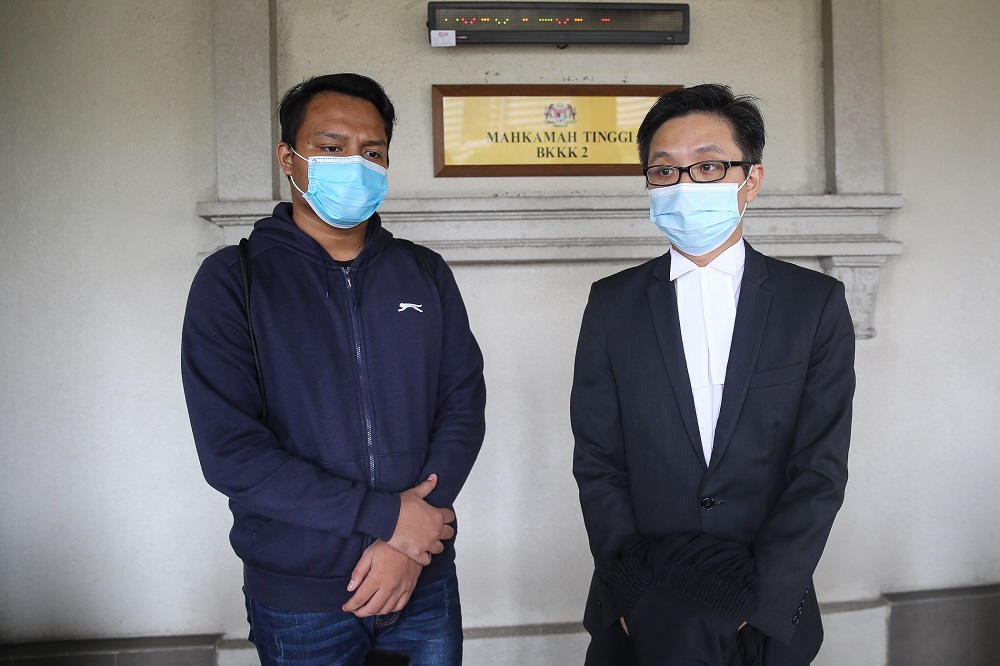 Aiman and his lawyer New Sin Yew at the High Court in Kuala Lumpur on August 5, 2020. ― Picture by Yusof Mat Isa