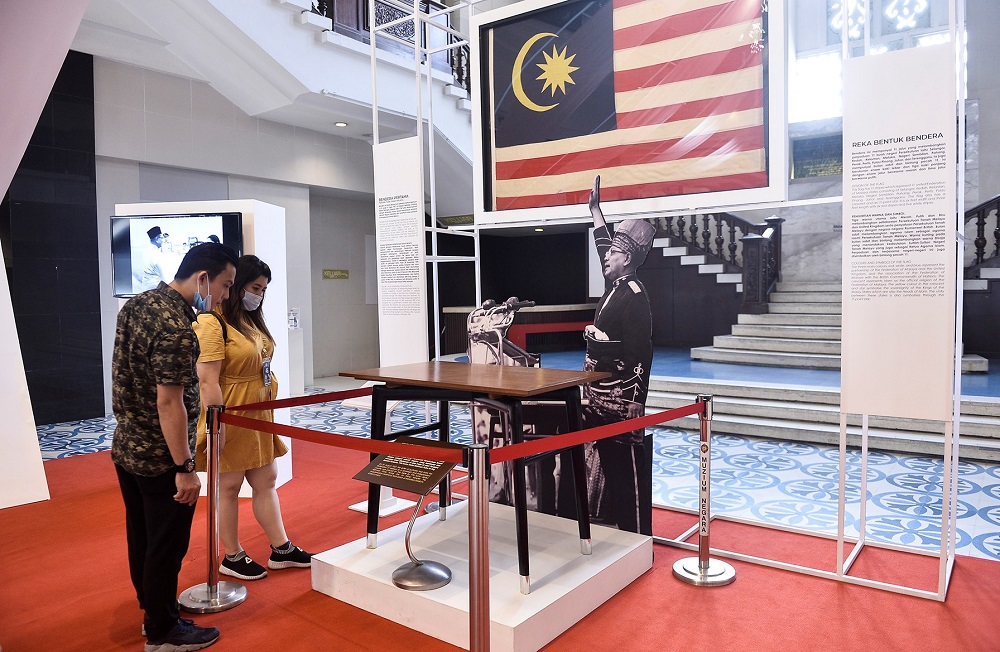The original Jalur Gemilang flag that had 11 stripes is also displayed at the Independence Day exhibition. u00e2u20acu2022 Picture by Miera Zulyana
