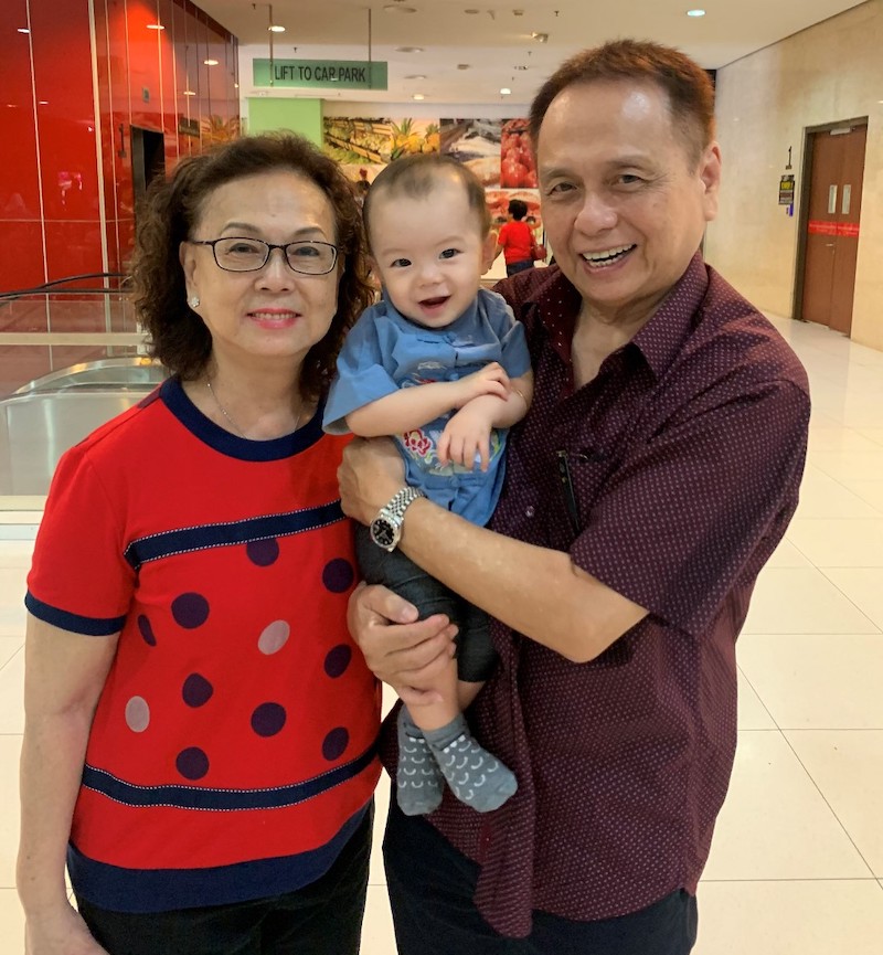 Sophia Seet, her husband and their grandson. — Picture courtesy of Lo Jin-Yi