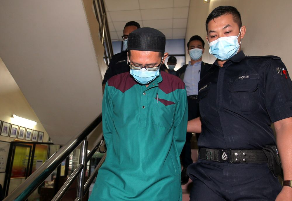 Civil servant Roslan Al Sidek Sulaiman is pictured at the Ipoh Sessions Court August 3, 2020. u00e2u20acu201d Picture by Farhan Najib