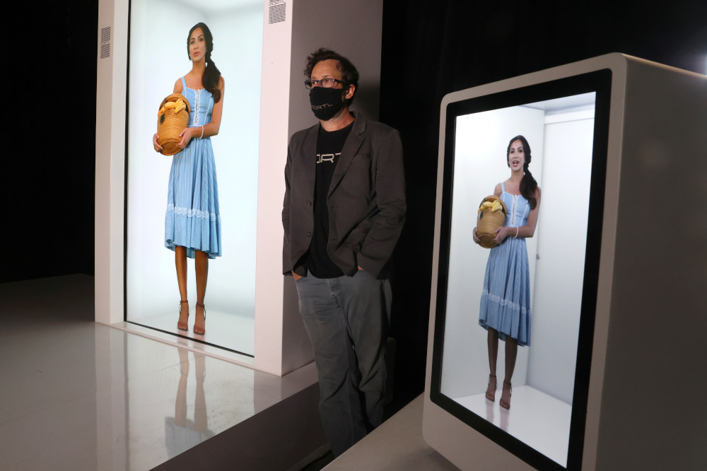 Portl inventor David Nussbaum poses for a photo next to an AI-powered life-size hologram of himself in Gardena, near Los Angeles, California, US, August 3, 2020. u00e2u20acu201d Reuters pi