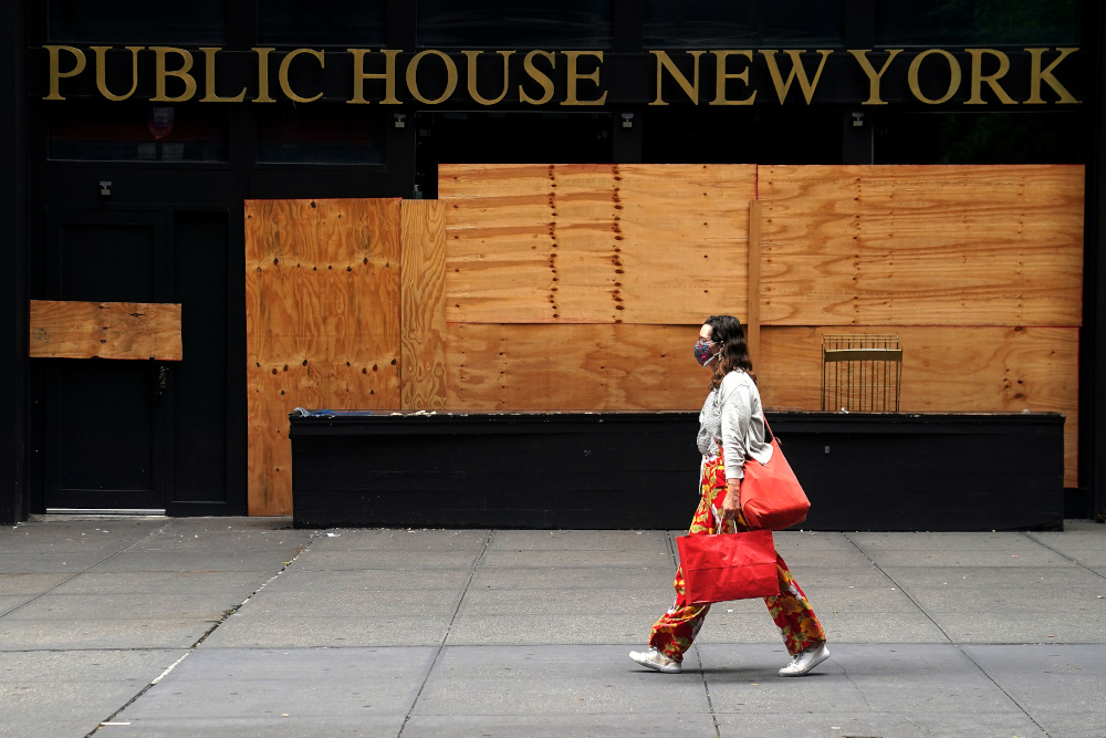 A woman walks past a shuttered bar following the coronavirus disease outbreak in the Manhattan borough of New York City, New York, US, August 7, 2020. u00e2u20acu201d Reuters pic 