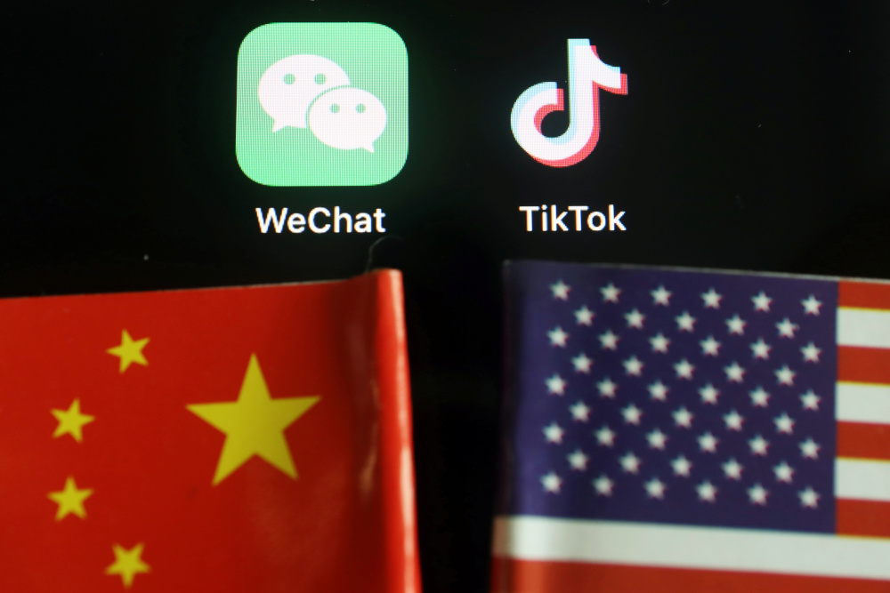 The messenger app WeChat and short-video app TikTok are seen near China and US flags in this illustration picture taken August 7, 2020. u00e2u20acu201d Reuters pic