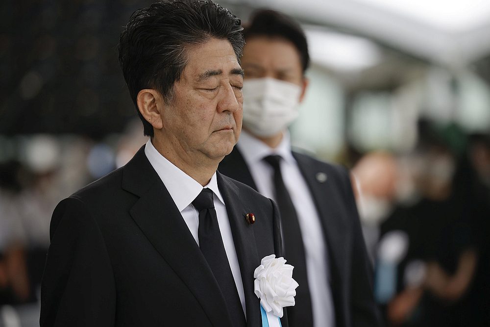 Japan's Prime Minister Shinzo Abe offers a silent prayer for the victims of the 1945 atomic bombing, at Peace Memorial Park in Hiroshima, western Japan, August 6, 2020. u00e2u20acu201d Kyodo pic via Reuters