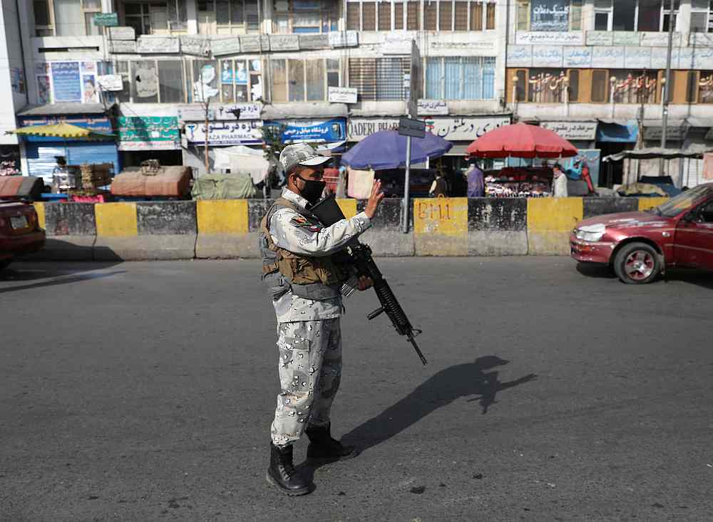An Afghan policeman stands guard at a check point in Kabul, Afghanistan August 7, 2020. u00e2u20acu201d Reuters pic