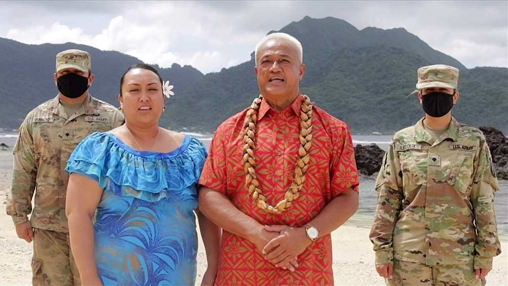 Delegates from American Samoa are flanked by two US soldiers in uniform as they cast the territory's votes for the Democratic presidential nomination in a video feed from American Samoa August 18, 2020. u00e2u20acu201d Pool pic via Reuters