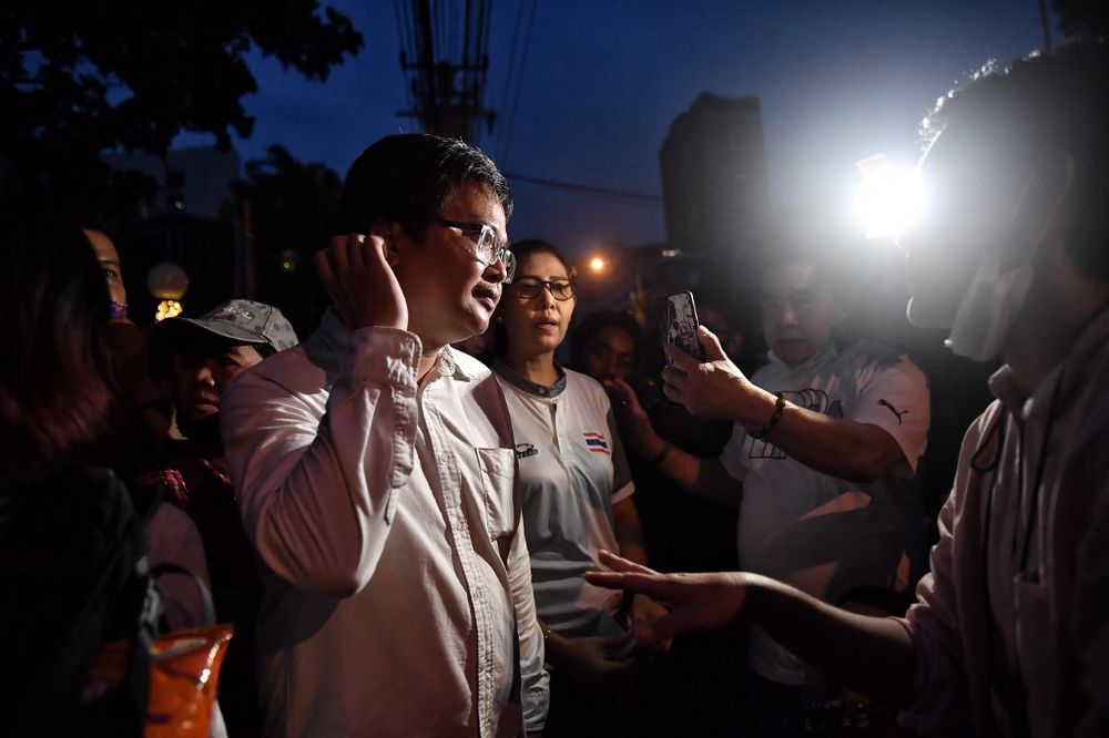 Thai lawyer Anon Numpa (left) speaks to the press following his release on bail outside the Criminal Court in Bangkok on August 20, 2020. u00e2u20acu201d AFP pic