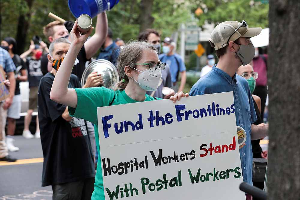 Demonstrators protest against changes in the postal service, outside of the condo of Postmaster General Louis DeJoy, in Washington August 15, 2020. u00e2u20acu201d Reuters pic