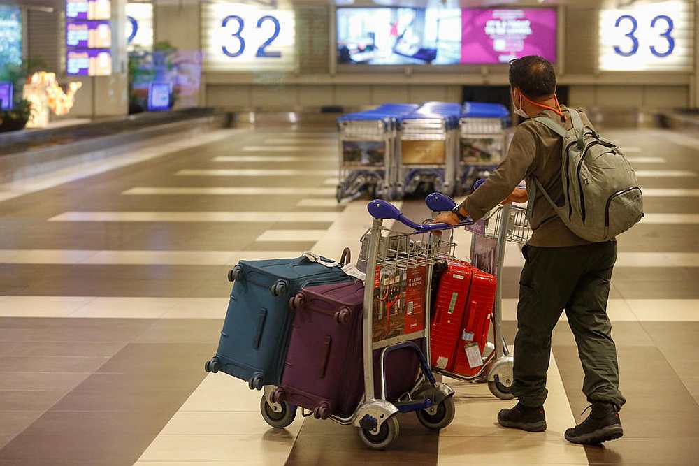 Upon arriving in Singapore, travellers serving their stay-home notice at their homes will be issued with the device at the checkpoints after clearing immigration. u00e2u20acu201d TODAY pic