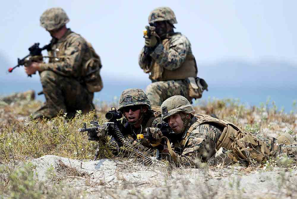 US forces take up positions during the annual 'Balikatan' (shoulder-to-shoulder) war games with Filipino soldiers at the shore of San Antonio, Zambales in northern Philippines April 21, 2015. u00e2u20acu201d Reuters pic