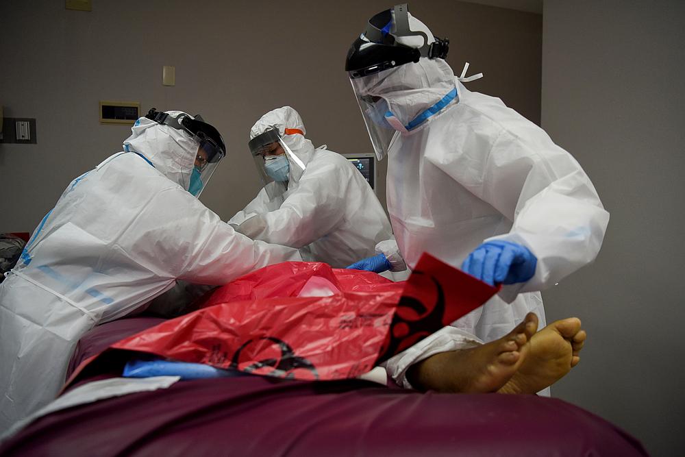 The body of a patient, who died during an intubation procedure, is prepared by nurses to be transported to a morgue, at United Memorial Medical Center in Houston, Texas July 17, 2020. u00e2u20acu201d Reuters pic