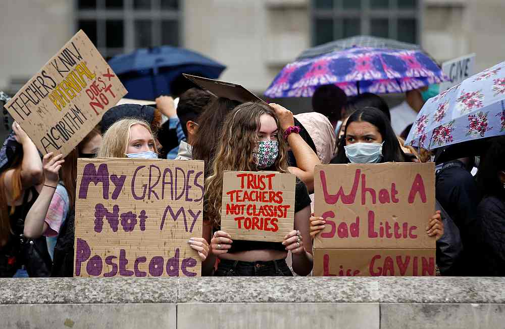 A-level students hold placards as they protest opposite Downing Street, amid the outbreak of Covid-19, in London, Britain August 16, 2020. u00e2u20acu201d Reuters pic