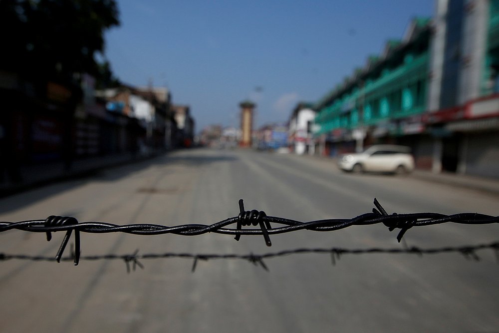 Barbed wire is seen laid on a deserted road during restrictions in Srinagar, August 5, 2019. u00e2u20acu201d Reuters pic