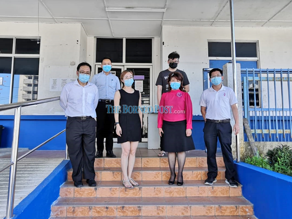 (Left) DAPu00e2u20acu2122s Chong Chieng Jen together with other DAP members leaving the police headquarters today after giving their statements. u00e2u20acu201d Picture by Borneo Post