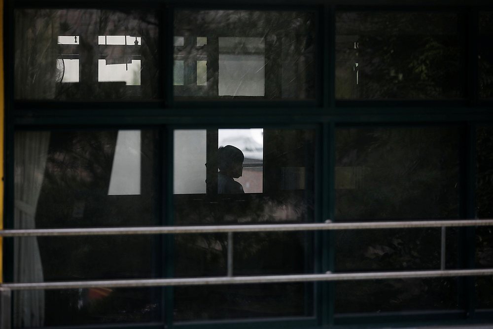 A boy wearing a mask walks past an empty classroom amid the Covid-19 pandemic at a middle school which is partly closed in Seoul, South Korea August 25, 2020. u00e2u20acu201d Reuters pic