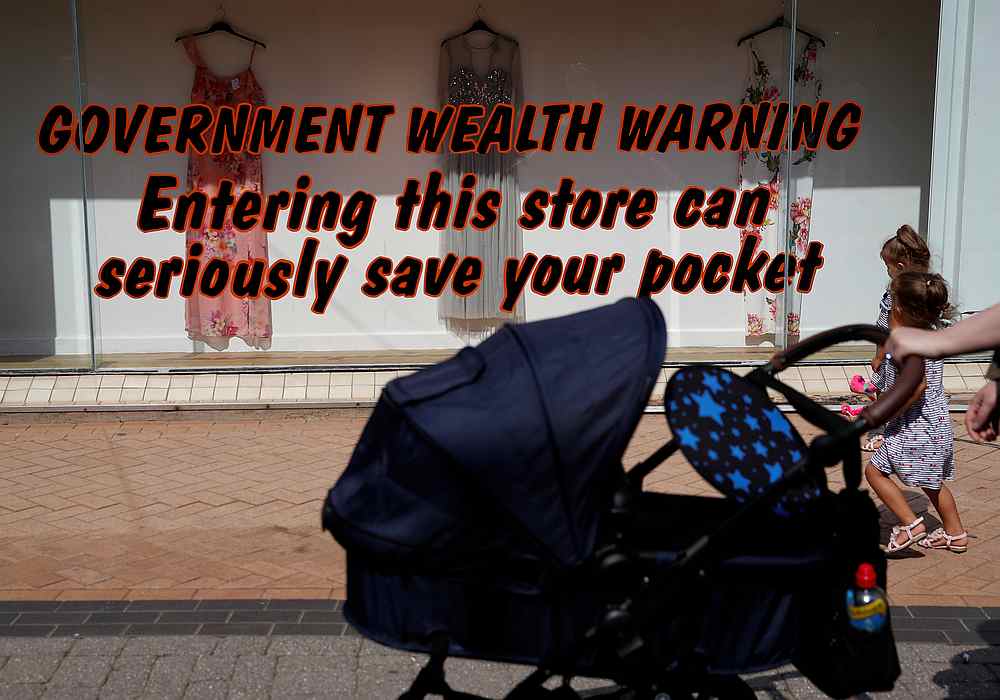 A woman pushes a pram past a clothes shop following the outbreak of Covid-19 in Blackpool, Britain, August 12, 2020. u00e2u20acu201d Reuters pic