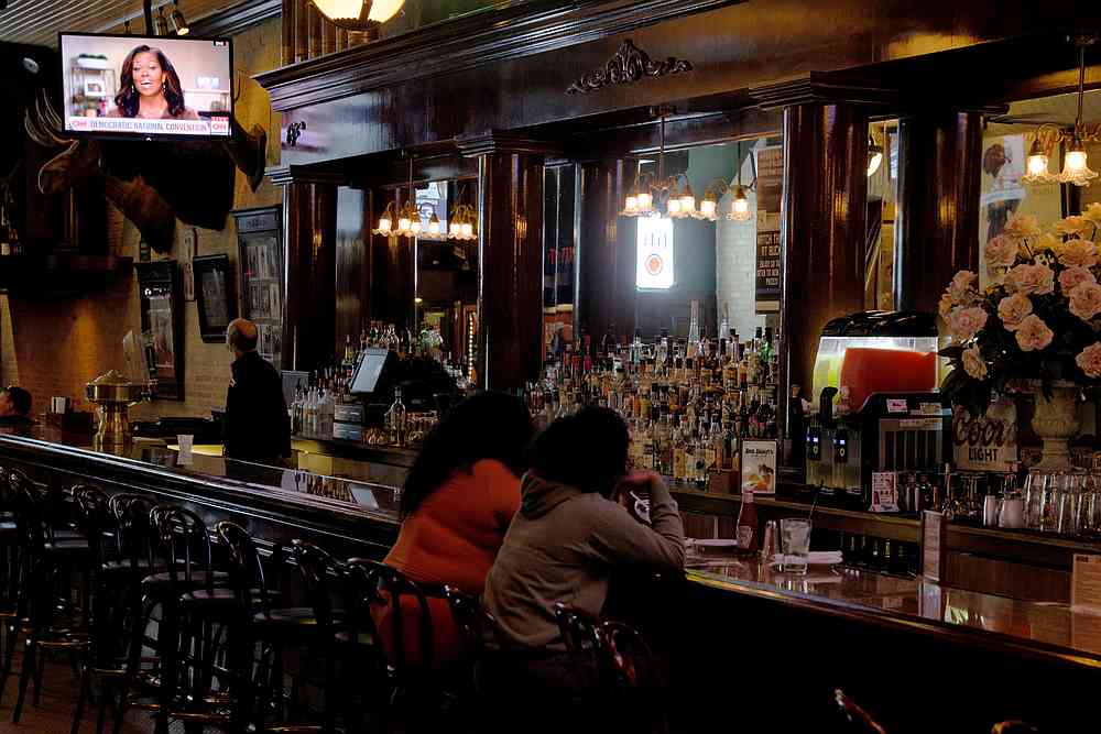 A television at Buck Bradleyu00e2u20acu2122s Saloon and Eatery shows former First Lady Michelle Obama speaking at the Democratic National Convention, in Milwaukee, Wisconsin August 17, 2020. u00e2u20acu201d Reuters pic