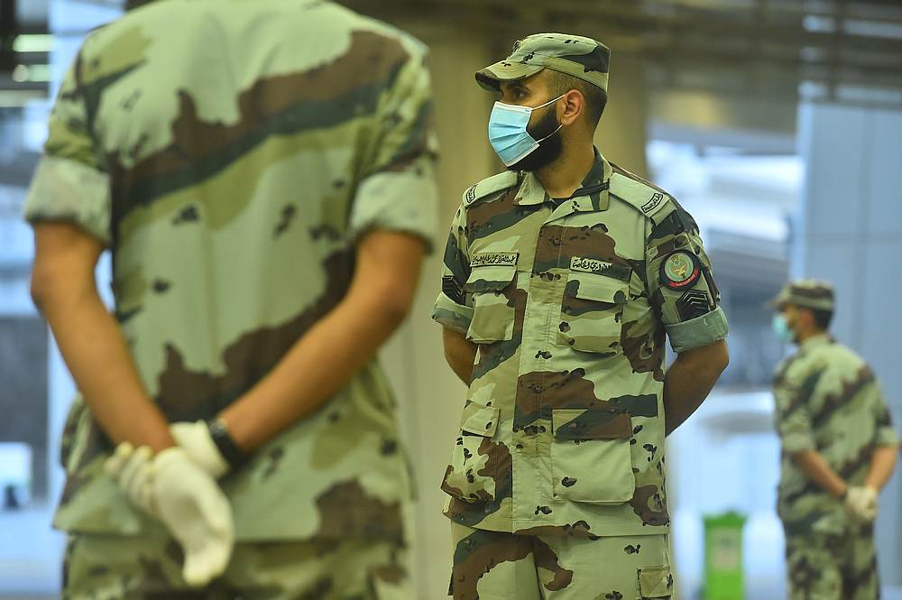 Saudi Haj Security Force personnel on guard as Muslim pilgrims head to cast stones at pillars symbolising Satan in Mina, near Mecca, Saudi Arabia July 31, 2020. u00e2u20acu201d Saudi Ministry of Media handout via Reuters