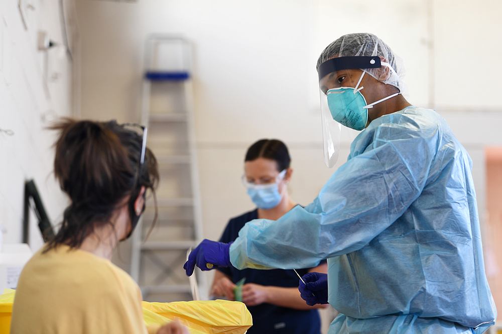 A healthcare worker prepares to conduct a Covid-19 test on a patient at a testing facility in Melbourne, Australia August 20, 2020. u00e2u20acu201d AAP Image via Reuters