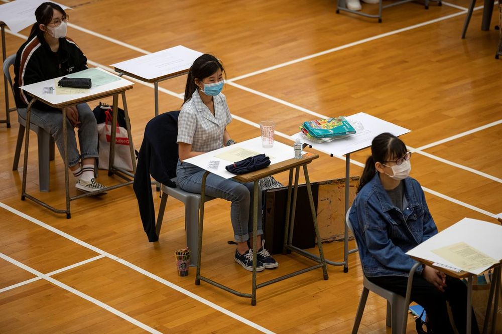 Students attend to take the Diploma of Secondary Education (DSE) exams, following the coronavirus disease (Covid-19) outbreak, in Hong Kong, China, 24 April 2020. u00e2u20acu201d Jerome Favre/ Pool via Reuters