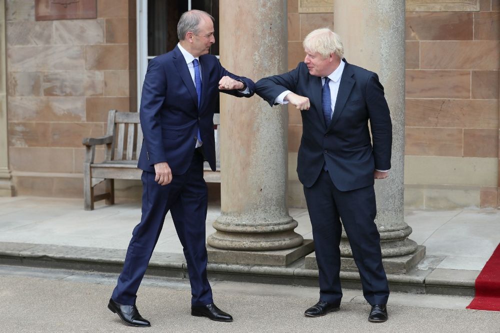 Britainu00e2u20acu2122s Prime Minister Boris Johnson (right) greets Irelandu00e2u20acu2122s Prime Minister Micheal Martin with an elbow touch as a safety measure because of the novel coronavirus pandemic on the steps of Hillsborough Castle in Belfast on August 13, 2020. u00e2u20acu201d AFP 