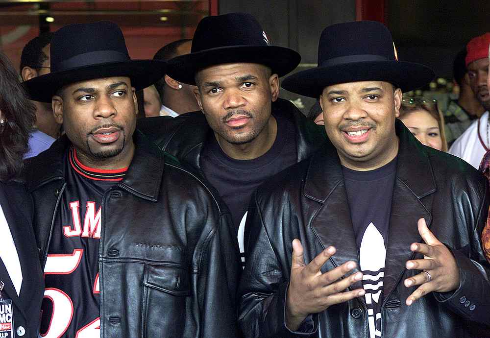 Members of RUN-DMC (from left) Jason Mizell (Jam Master Jay), Darryl McDaniels (DMC) and Joseph Simmons (DJ Run) after being inducted into Hollywood's Rockwalk February 25, 2002 in Los Angeles, California. u00e2u20acu201d Reuters pic