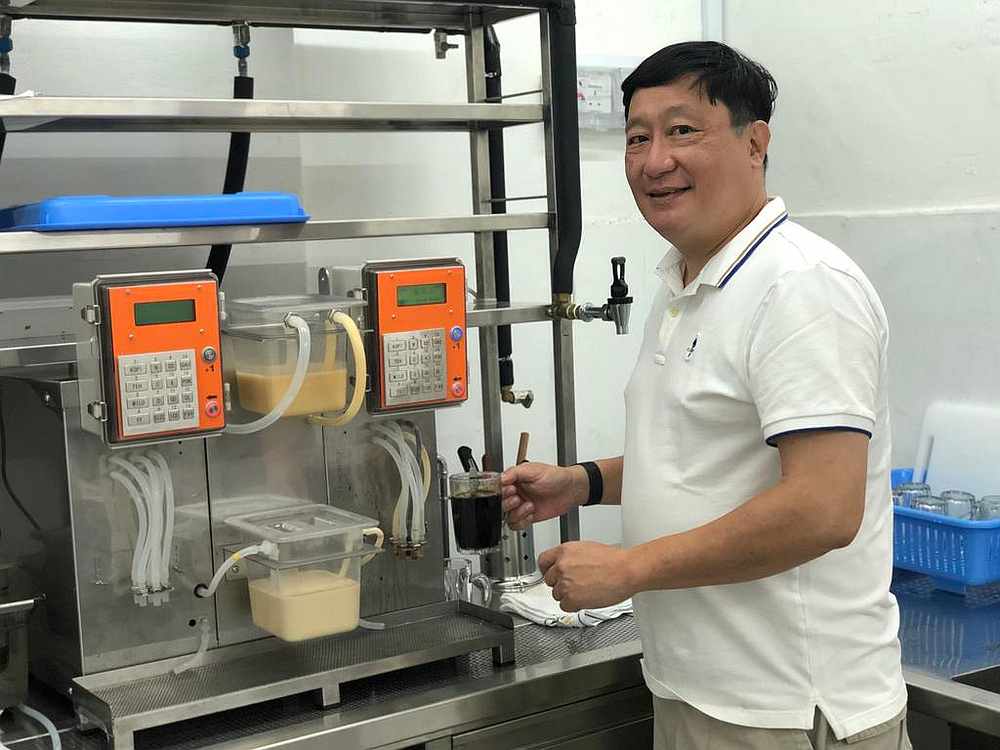 Hawkermatic founder Jason Thai (pictured) created the KopiMatic when he could not find a skilled kopi 'tao chiew.' The team plans to roll out 1,000 machines by 2022. u00e2u20acu201d TODAY pic