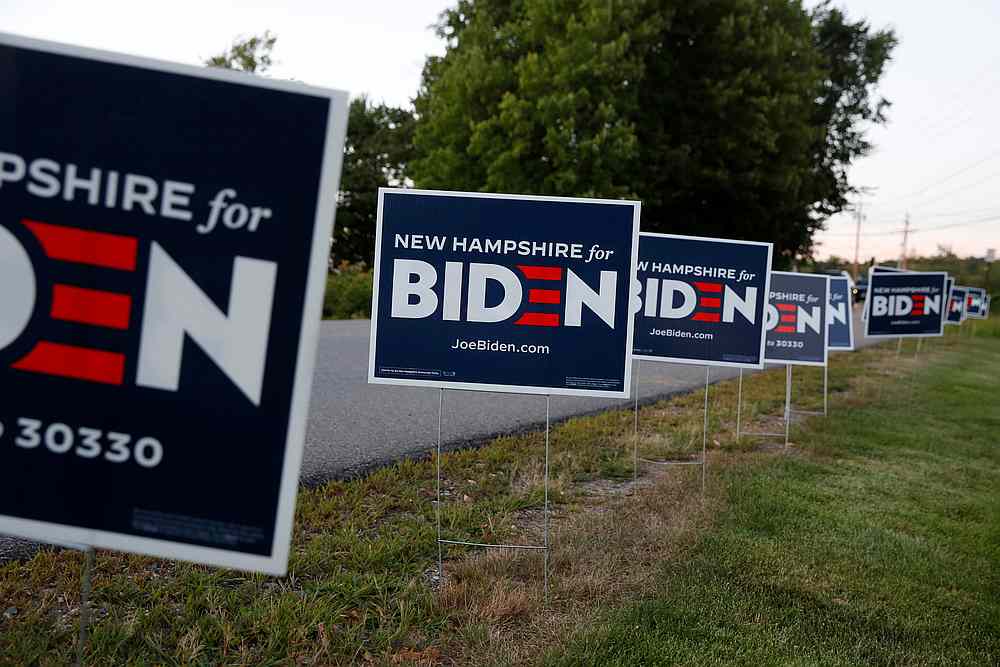 Campaign signs are seen before the start of a drive-in watch party for the Democratic National Convention (DNC) in Derry, New Hampshire August 20, 2020. u00e2u20acu201d Reuters pic