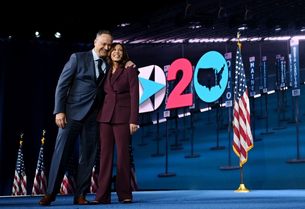 Senator from California and Democratic vice presidential nominee Kamala Harris and her husband Douglas Emhoff stand on stage at the end of the third day of the Democratic National Convention, being held virtually amid the novel coronavirus pandemic, at th