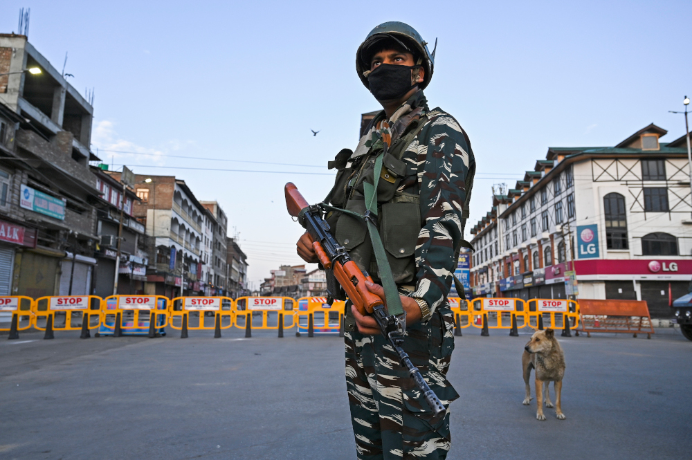 A paramilitary soldier stands guard at a checkpoint during a curfew in Srinagar on August 4, 2020. u00e2u20acu201d AFP Pic