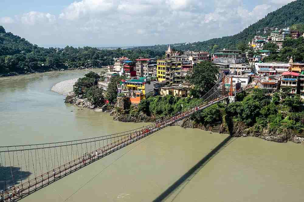 People walking on the Lakshman Jhula footbridge over the Ganges river in Rishikesh, India October 2, 2019. u00e2u20acu201d AFP pic