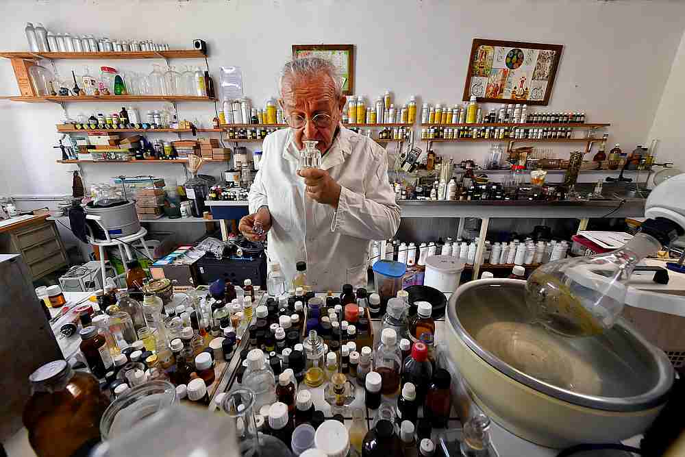 Geneticist and 'aroma sculpturer' Michael Moisseeff sniffs a bottle at his laboratory in his home in Montegut-Lauragais near Toulouse, southwestern France July 29, 2020. u00e2u20acu201d AFP pic