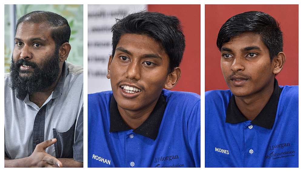 While teacher Aravind Thiyagan (far left) finds his job empowering, students Roshan and Dineskumar have been enjoying the electrical lessons under MySkills. — Picture by Miera Zulyana