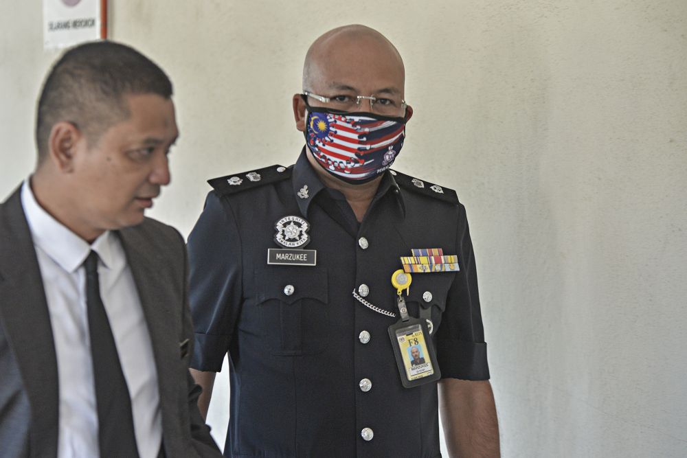 Nilai police chief Supt Mohd Marzukee Besar arrives at the Seremban Court Complex August 25, 2020. u00e2u20acu201d Picture by Shafwan Zaidon