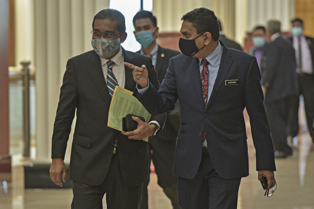 Minister in the Prime Minister's Department Datuk Takiyuddin Hassan (left) is pictured in Parliament, Kuala Lumpur August 27, 2020. u00e2u20acu201d Picture by Shafwan Zaidon