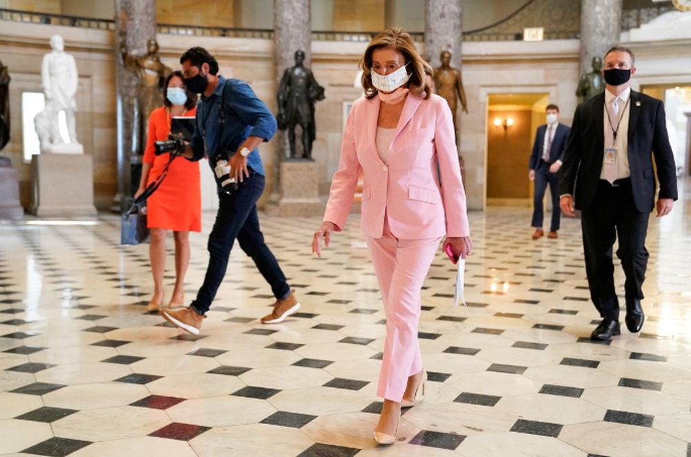 Speaker of the House Nancy Pelosi walks through the US Capitol as the House of Representatives meets on Saturday to vote on the u00e2u20acu02dcDelivering for America Actu00e2u20acu2122 legislation, prohibiting changes to the United States Postal Service (USPS), in Washington, US