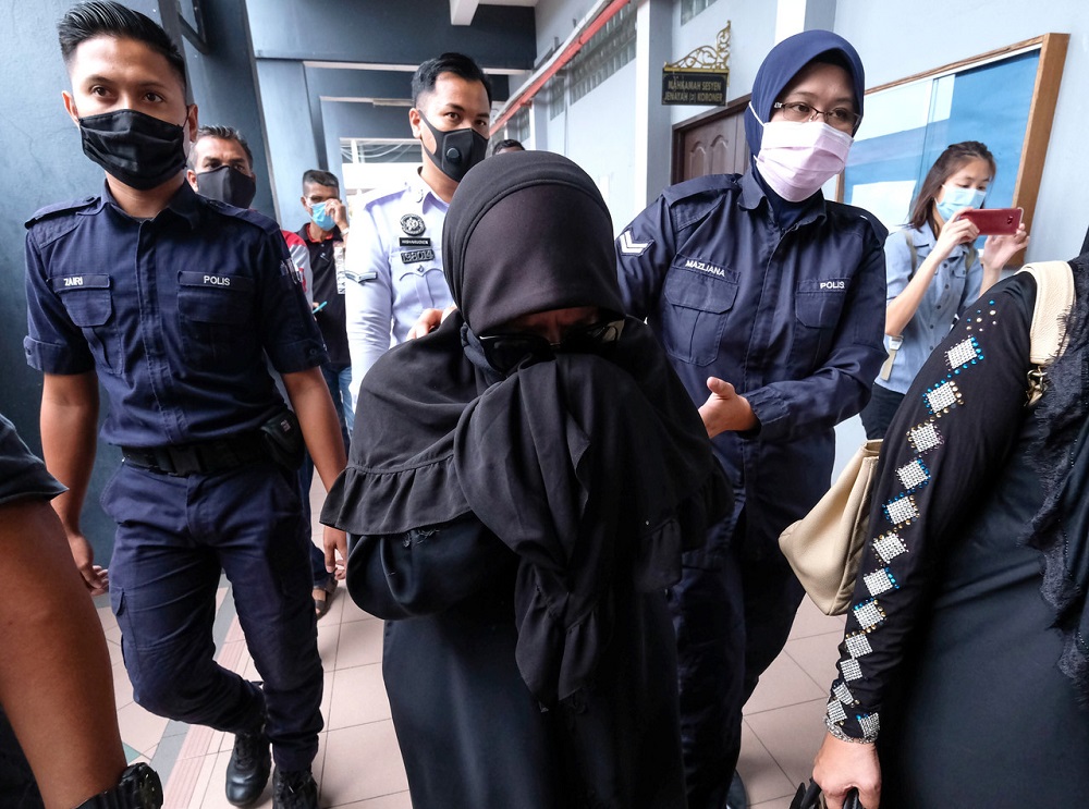 Nur Emah Mohamad Hashim, dubbed the 'pink wristband woman' on social media, is seen at the Magistrateu00e2u20acu2122s Court in Ipoh August 14, 2020.  u00e2u20acu201d Bernama pic 