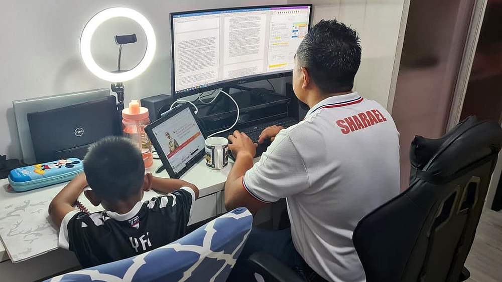 MP for Pasir Ris-Punggol Group Representation Constituency Sharael Taha with his five-year-old son. u00e2u20acu201d Picture courtesy of Sharael Taha via TODAY