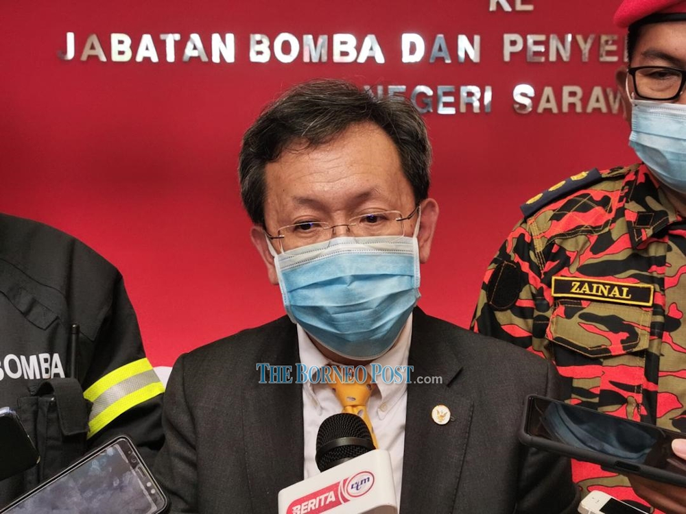 Datuk Seri Dr Sim Kui Hian speaks to reporters after a function at the Fire and Rescue Department (Bomba) state headquarters August 26, 2020. u00e2u20acu201d Picture by Roystein Emmor/Borneo Post