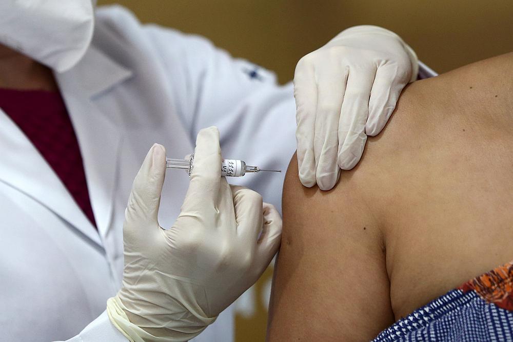 Nurse Isabelli Guasso administers China's Sinovac vaccine, a potential vaccine for Covid-19, to volunteer and nurse Fabiana Souza, in Porto Alegre, Brazil August 8, 2020. u00e2u20acu201d Reuters pic