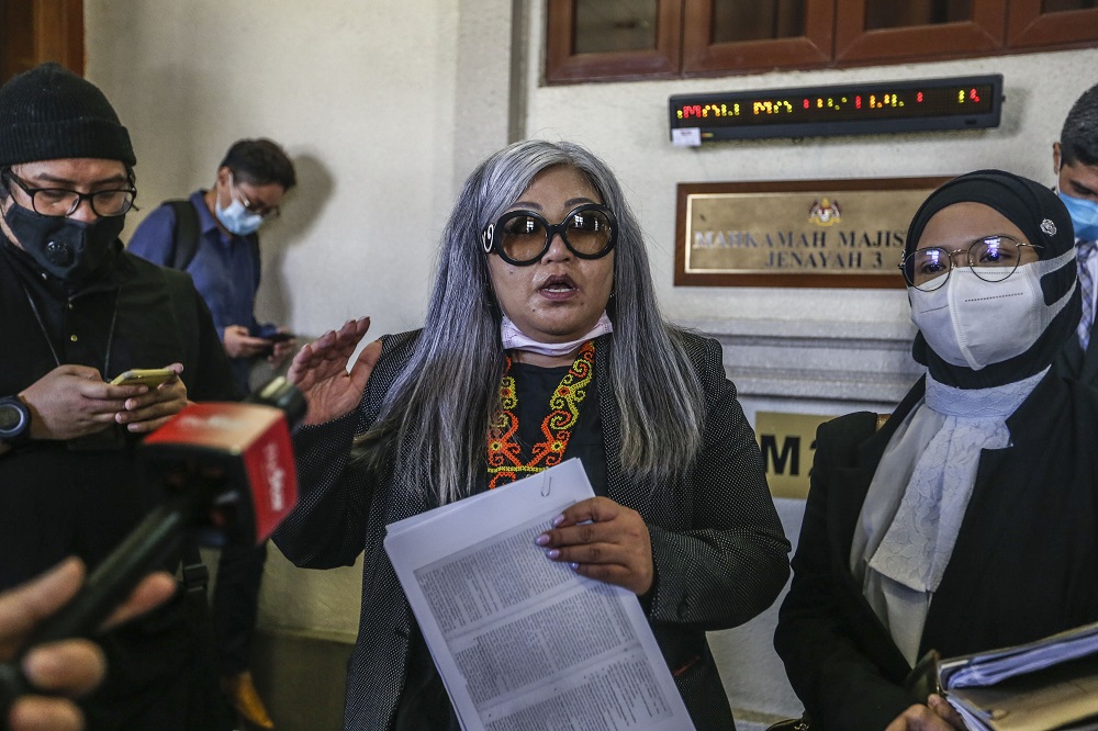 Human rights activist Siti Kasim is seen with her lawyer Suzana Norlihan Alias at the Kuala Lumpur Court Complex August 21, 2020. u00e2u20acu2022 Picture by Firdaus Latif 