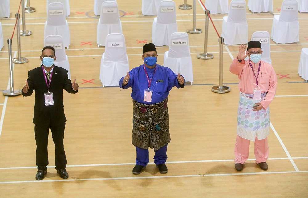 (From left) Independent candidate Santharasekaran Subramanian, Barisan Nasionalu00e2u20acu2122s Mohd Zaidi Aziz  and Pejuangu00e2u20acu2122s Amir Khusyairi Mohamad Tanusi at the nomination centre in Tanjong Malim August 15, 2020. u00e2u20acu2022 Picture by Farhan Najib