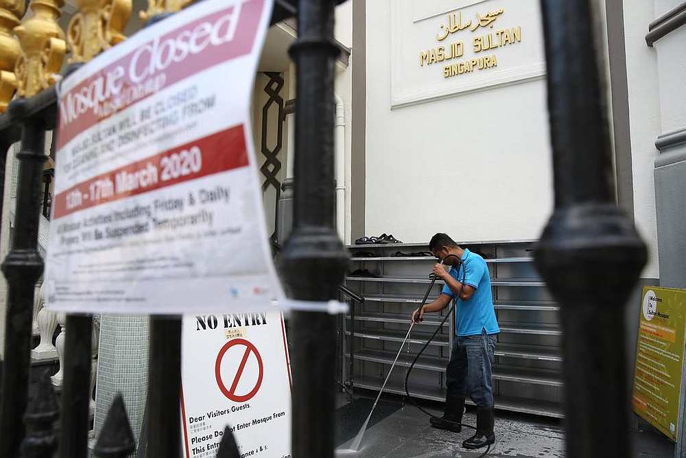 A worker cleaning the premises of Sultan Mosque, Singaporeu00c2u00a0earlier in March 2020. u00e2u20acu201d TODAY pic