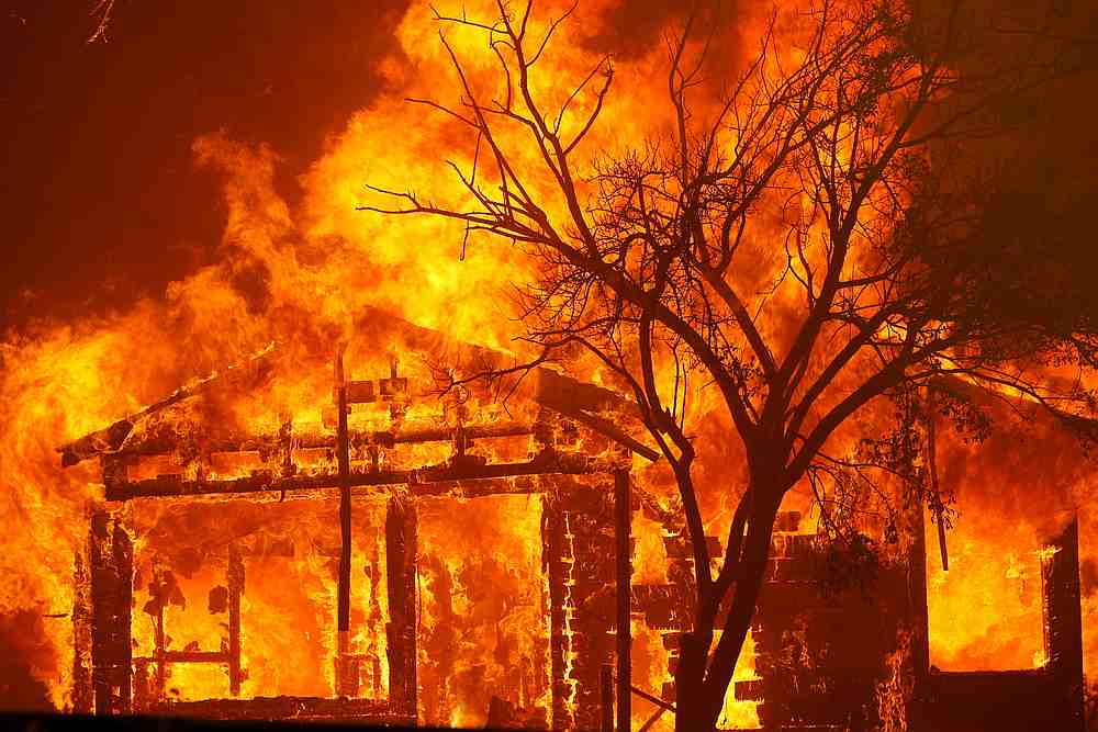 A burning home is seen along Cherry Glen Road during the LNU Lighting Complex Fire on the outskirts of Vacaville, California August 19, 2020. u00e2u20acu201d Reuters pic