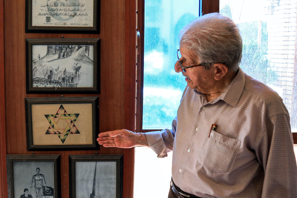 Omar Farhadi points to a frame showing a stylised Star of David hanging in a room dedicated to famous Jewish Kurdish art teacher and painter Daniel Kassab in the capital of the autonomous Kurdish region, July 5, 2020. u00e2u20acu201d AFP pic