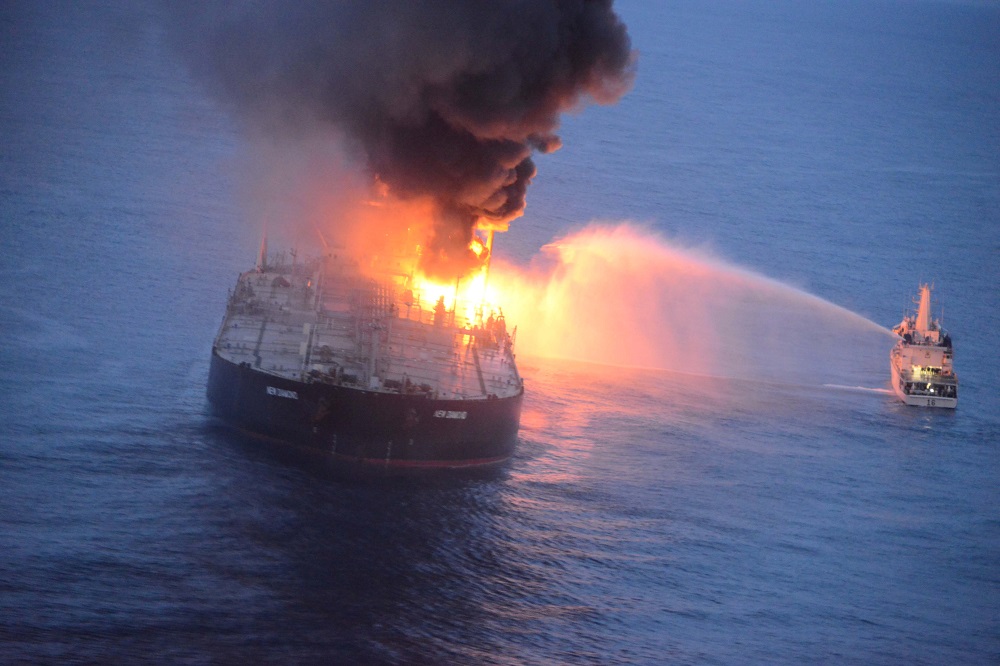 A Sri Lankan Navy boat sprays water on the New Diamond, a very large crude carrier chartered by Indian Oil Corp, after a fire broke out off east coast of Sri Lanka September 4, 2020. u00e2u20acu201d Picture courtesy of Sri Lankan Airforce media/Handout via Reuters