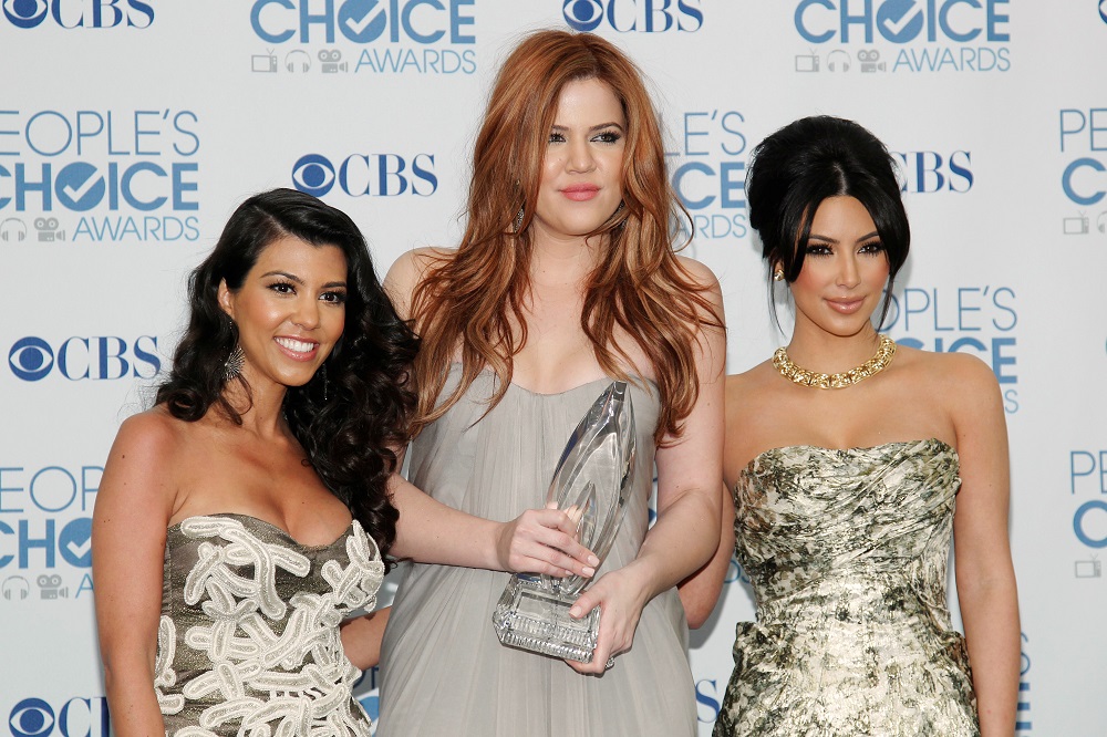 Reality television sisters (from left) Kourtney, Khloe and Kim Kardashian pose with their favorite guilty pleasure award for 'Keeping Up with the Kardashians' at the 2011 People's Choice Awards in Los Angeles January 5, 2011. u00e2u20acu201d Reuters pic