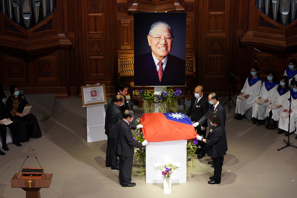 Taiwan Vice President William Lai and ministers hold a national flag at a memorial service for late Taiwan president Lee Teng-hui at a chapel of Aletheia University in New Taipei City September 19, 2020. u00e2u20acu201d Picture by Central News Agency/Pool via Reuters