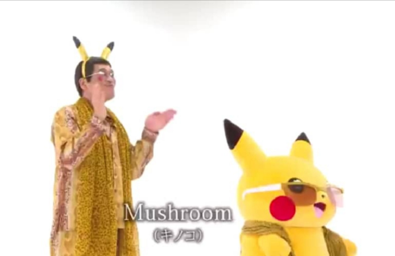 Singer/comedian Pikotaro (left) is back with a new song with Pikachu and it is fast gaining popularity just three days after it was released. u00e2u20acu201d Screen capture via YouTube