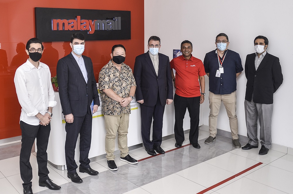 Iran’s Ambassador Ali Asghar Mohammadi (centre) poses for a group photo after a visit to Malay Mail’s office in Petaling Jaya September 9, 2020. — Picture by Miera Zulyana